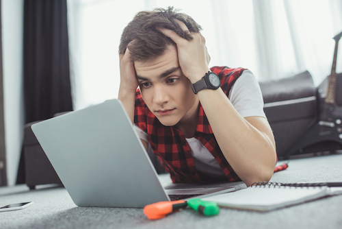 Frustrated high school student doing homework